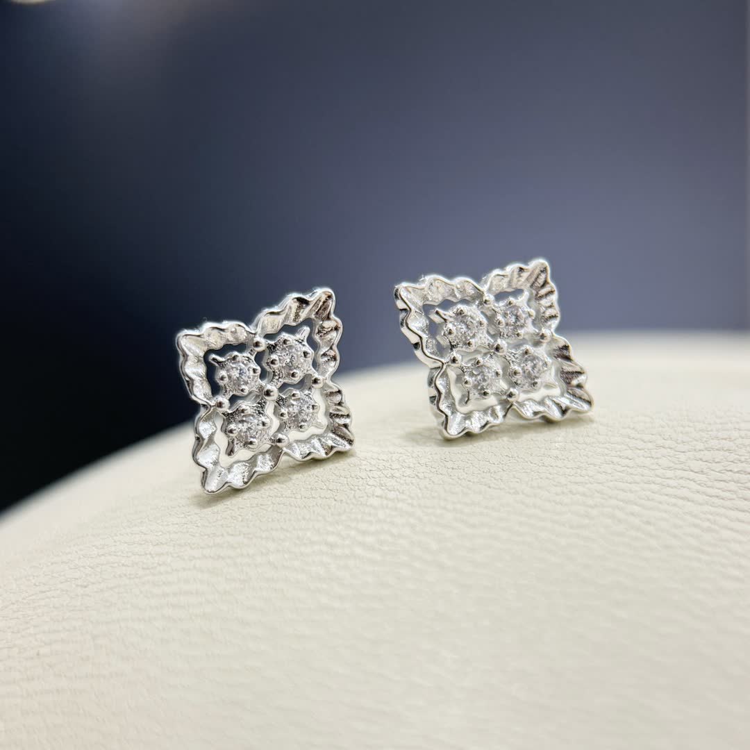 Van Cleef & Arpels Elegant Silver Stud Earrings with Diamond Accents